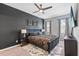 This bedroom has a tray ceiling, ceiling fan, and plush carpeting at 2943 Willowleaf Ln, Wesley Chapel, FL 33544