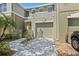 A great townhouse featuring a courtyard, one car garage, and low maintenance landscaping at 2943 Willowleaf Ln, Wesley Chapel, FL 33544