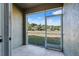 Screened patio offering an outdoor retreat, providing a serene view of the surrounding greenery and clear skies at 2943 Willowleaf Ln, Wesley Chapel, FL 33544