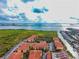 Aerial shot showcasing the community's waterfront location, lush surroundings, and residential buildings at 4333 Bayside Village Dr # 310, Tampa, FL 33615