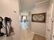 Hallway with neutral walls, and a view into the kitchen and living spaces beyond at 4333 Bayside Village Dr # 310, Tampa, FL 33615
