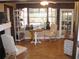The bonus room features light-filled with a large bay window with shelving and a comfortable seating area at 7026 Lenape Cir, New Port Richey, FL 34653