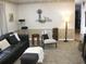 Comfortable living room with a couch, chairs, ottoman and side tables perfect for entertaining at 7026 Lenape Cir, New Port Richey, FL 34653
