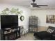 Cozy living room with a large TV and electric fireplace, perfect for relaxing and entertainment at 7026 Lenape Cir, New Port Richey, FL 34653