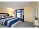 Brightly-lit bedroom with striped curtains and a decorative nautical theme at 7418 Riverbank Dr, New Port Richey, FL 34655