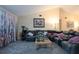 Spacious living room with a plush sectional sofa, cat tree, and vaulted ceiling at 7418 Riverbank Dr, New Port Richey, FL 34655