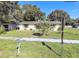 Charming single story home with a well manicured lawn and sidewalk at 1970 Mckinley St, Clearwater, FL 33765