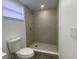 Bright bathroom features a step-in shower with a showerhead at 22011 Catherine Ave, Port Charlotte, FL 33952