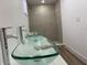 Modern bathroom features glass bowl sinks, a large shower, and chrome faucets at 22011 Catherine Ave, Port Charlotte, FL 33952
