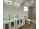 Modern bathroom features a double sink vanity and step-in shower at 22011 Catherine Ave, Port Charlotte, FL 33952