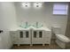 Modern bathroom with double sinks and updated vanity provides lots of space at 22011 Catherine Ave, Port Charlotte, FL 33952