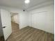 Bright bedroom features vinyl flooring and a closet at 22011 Catherine Ave, Port Charlotte, FL 33952
