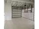 Spacious two car garage with an automatic door and block-wall ventilation system at 22011 Catherine Ave, Port Charlotte, FL 33952