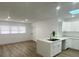Well-lit kitchen with white cabinets, quartz countertops, and a stylish faucet at 22011 Catherine Ave, Port Charlotte, FL 33952