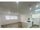 Bright kitchen with white cabinets, stainless steel appliances, and a skylight at 22011 Catherine Ave, Port Charlotte, FL 33952