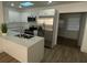 Modern kitchen featuring stainless steel appliances, white cabinets, and a breakfast bar at 22011 Catherine Ave, Port Charlotte, FL 33952