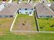 Aerial view of backyard, showcasing patio and yard size at 5289 Fiddle Fig Ave, Wimauma, FL 33598