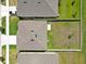 Aerial view of a well-maintained property showing the roof and spacious fenced backyard at 5289 Fiddle Fig Ave, Wimauma, FL 33598