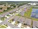 Wide angle aerial shot showing property with a nearby pond at 5289 Fiddle Fig Ave, Wimauma, FL 33598