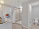 Bathroom featuring neutral tiling and glass enclosed shower at 5289 Fiddle Fig Ave, Wimauma, FL 33598