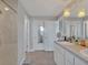 Bathroom featuring a large mirror and updated vanity at 5289 Fiddle Fig Ave, Wimauma, FL 33598