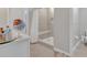 Bathroom featuring a sink and vanity, tile flooring, with a convenient walk-in shower at 5289 Fiddle Fig Ave, Wimauma, FL 33598