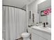 Well-maintained bathroom with a shower-tub combo, providing a functional and clean space at 5289 Fiddle Fig Ave, Wimauma, FL 33598