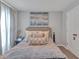 Cozy bedroom featuring elegant decor, soft lighting, and comfortable furnishings, creating a relaxing retreat at 5289 Fiddle Fig Ave, Wimauma, FL 33598