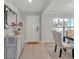 Welcoming entryway with stylish decor, leading to a dining area and featuring ample natural light at 5289 Fiddle Fig Ave, Wimauma, FL 33598