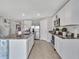 Bright kitchen features granite countertops, stainless steel appliances, and white cabinetry at 5289 Fiddle Fig Ave, Wimauma, FL 33598