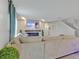 Open-concept living room featuring a cozy fireplace, decorative wall art, and comfortable seating at 5289 Fiddle Fig Ave, Wimauma, FL 33598