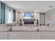 Modern living room with fireplace and blue accent lighting at 5289 Fiddle Fig Ave, Wimauma, FL 33598