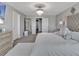 A spacious main bedroom has a large mirror and a big closet at 5289 Fiddle Fig Ave, Wimauma, FL 33598