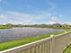 Backyard view of a pond in a quiet neighborhood at 5289 Fiddle Fig Ave, Wimauma, FL 33598