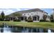 Backyard of homes showing screened in porches and view of pond at 12232 Trailhead Dr, Bradenton, FL 34211