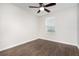 Bedroom with hard wood floors, a ceiling fan, and a single window at 12232 Trailhead Dr, Bradenton, FL 34211