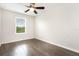 Bedroom with hard wood floors, a ceiling fan, and a single window at 12232 Trailhead Dr, Bradenton, FL 34211