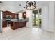 Kitchen boasts stainless appliances, granite countertops, a large island, and access to the lanai at 12232 Trailhead Dr, Bradenton, FL 34211