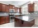 Close-up view of the kitchen featuring stainless steel appliances and granite counters at 12232 Trailhead Dr, Bradenton, FL 34211