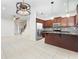 Open kitchen featuring stainless appliances, tile floors, granite counters and a large island at 12232 Trailhead Dr, Bradenton, FL 34211