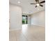 Spacious living area features tile floors and lanai access at 12232 Trailhead Dr, Bradenton, FL 34211