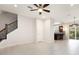 Open floor plan offering living space with views of the kitchen and staircase at 12232 Trailhead Dr, Bradenton, FL 34211
