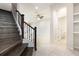 Staircase featuring dark wood stairs and decorative railing at 12232 Trailhead Dr, Bradenton, FL 34211