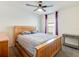 Well-lit bedroom with a comfortable queen-size bed and simple decor at 1324 Ocean Spray Dr, Ruskin, FL 33570