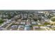 Aerial view of a residential neighborhood with a variety of single-Gathering homes and tree-lined streets at 1790 Pomelo Dr, Venice, FL 34293