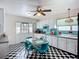 Charming kitchen features retro-style appliances, turquoise accents, and black and white checkered floors at 1790 Pomelo Dr, Venice, FL 34293