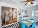 Spacious kitchen with checkerboard floor, dining set, and view to other rooms at 1790 Pomelo Dr, Venice, FL 34293