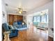 Spacious living room with hardwood floors, built-in shelving, and ample seating at 1790 Pomelo Dr, Venice, FL 34293