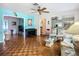 Spacious living room features hardwood floors, turquoise accents, and an open layout for entertaining at 1790 Pomelo Dr, Venice, FL 34293