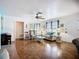 Bright living room with wood floors, comfortable seating, and ample natural light at 1790 Pomelo Dr, Venice, FL 34293